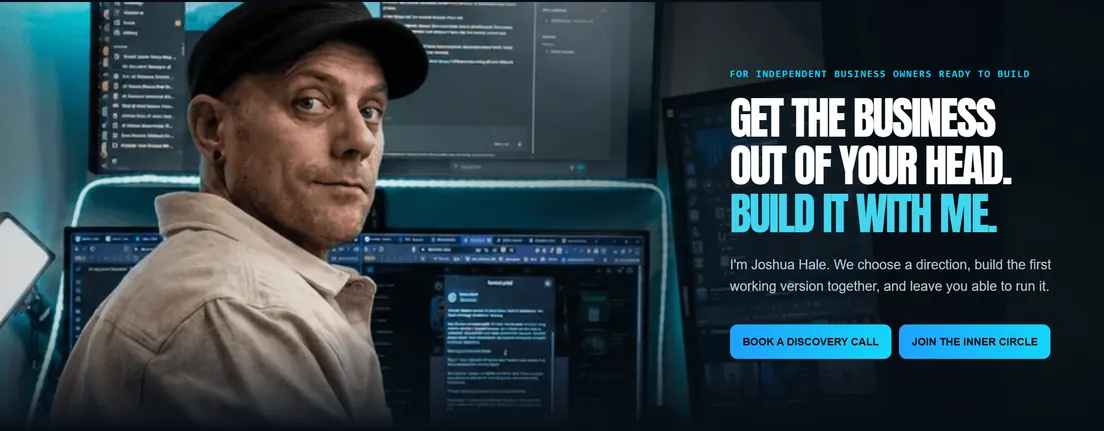 Joshua Hale in a cap at his desk, in front of several screens, next to the words: Get the business out of your head. Build it with me.